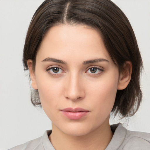 Neutral white young-adult female with medium  brown hair and brown eyes