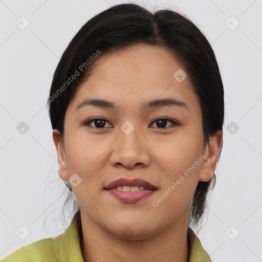 Joyful asian young-adult female with medium  brown hair and brown eyes