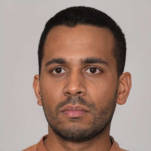 Neutral latino young-adult male with short  black hair and brown eyes