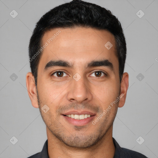 Joyful white young-adult male with short  black hair and brown eyes