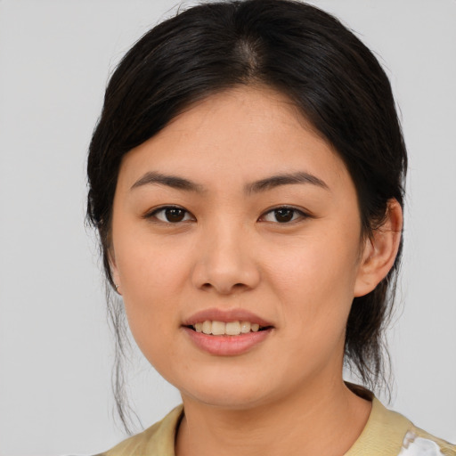 Joyful asian young-adult female with medium  brown hair and brown eyes
