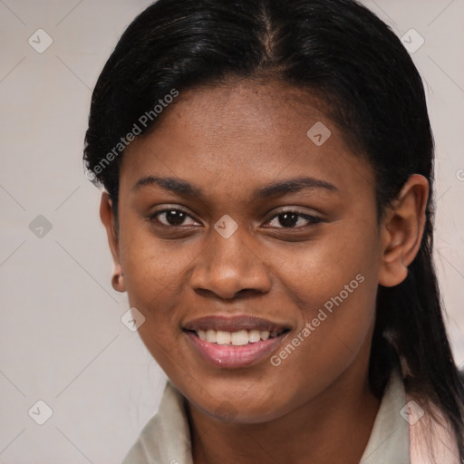 Joyful black young-adult female with long  brown hair and brown eyes