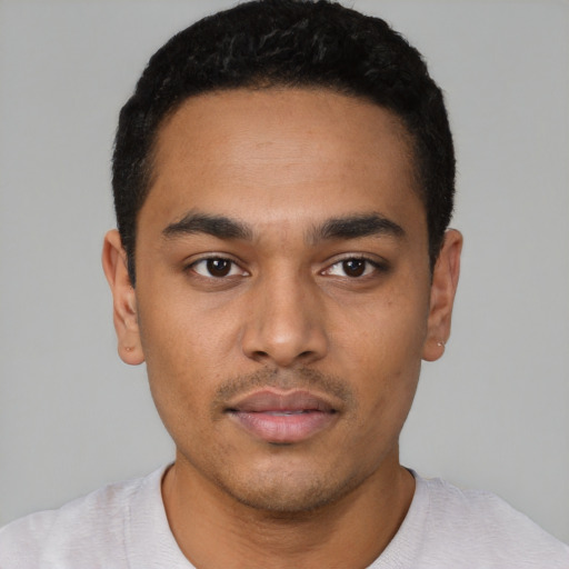Neutral latino young-adult male with short  black hair and brown eyes