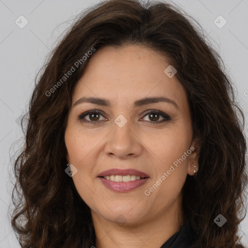 Joyful white adult female with long  brown hair and brown eyes