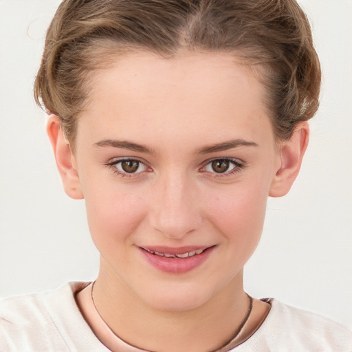 Joyful white child female with short  brown hair and brown eyes