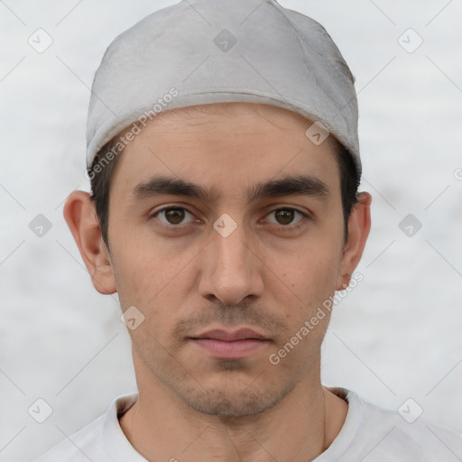 Neutral white young-adult male with short  black hair and brown eyes