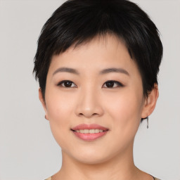 Joyful asian young-adult female with short  black hair and brown eyes