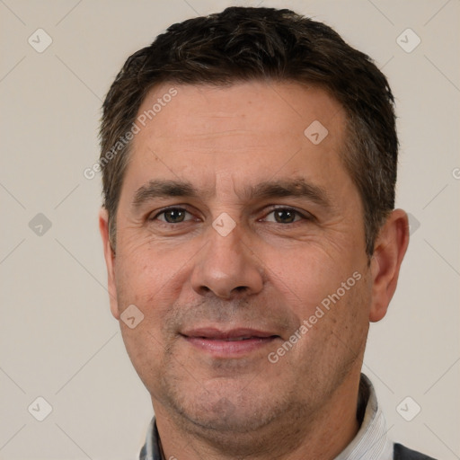 Joyful white adult male with short  brown hair and brown eyes