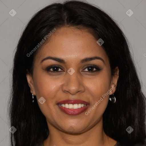 Joyful latino young-adult female with long  brown hair and brown eyes