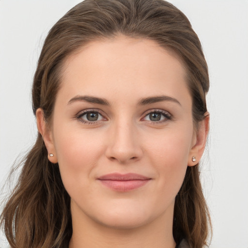 Joyful white young-adult female with long  brown hair and grey eyes