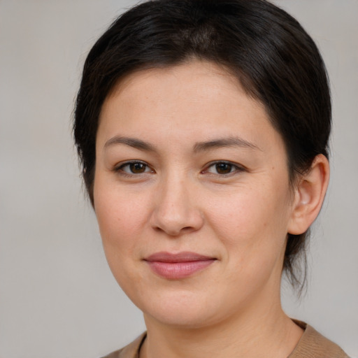 Joyful white young-adult female with medium  brown hair and brown eyes