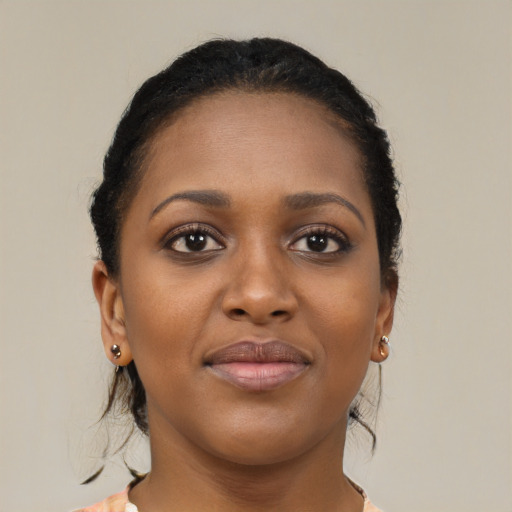 Joyful black young-adult female with medium  brown hair and brown eyes