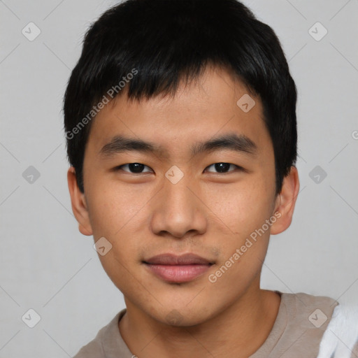 Joyful asian young-adult male with short  brown hair and brown eyes