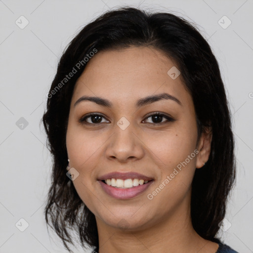 Joyful latino young-adult female with medium  brown hair and brown eyes