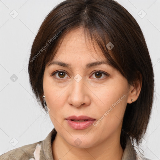 Joyful white adult female with medium  brown hair and brown eyes