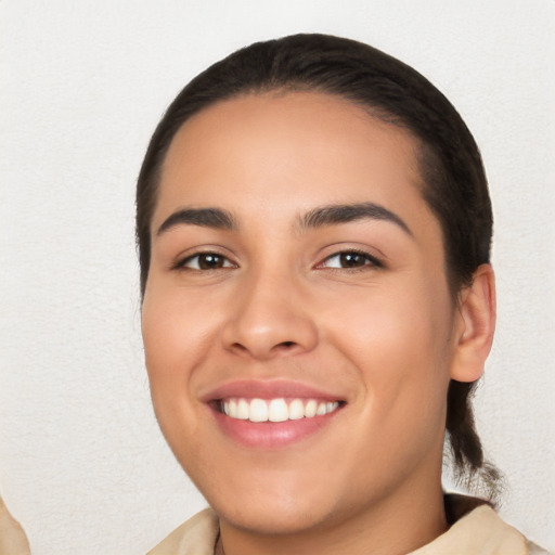 Joyful white young-adult female with long  black hair and brown eyes