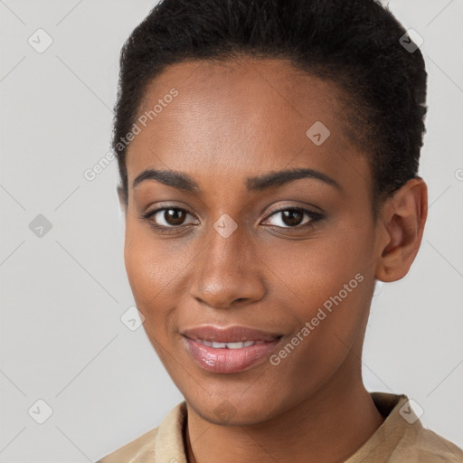 Joyful black young-adult female with short  brown hair and brown eyes