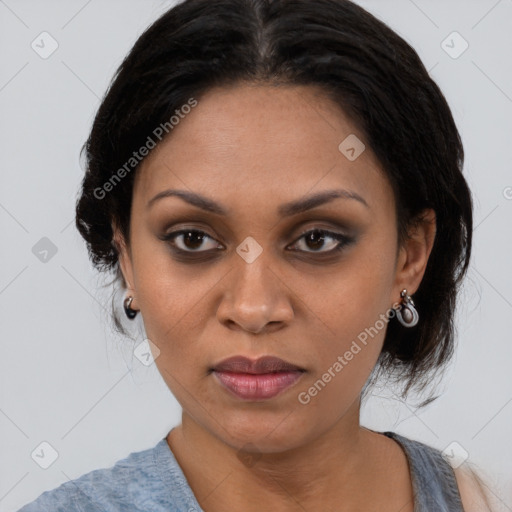 Joyful black young-adult female with medium  brown hair and brown eyes