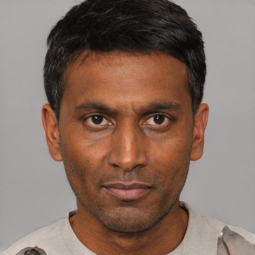 Neutral black adult male with short  black hair and brown eyes