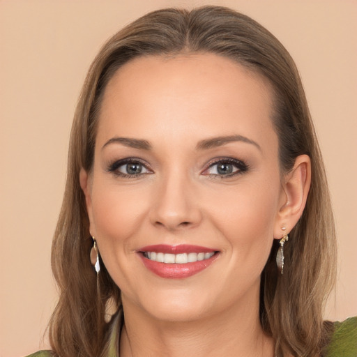 Joyful white young-adult female with long  brown hair and brown eyes