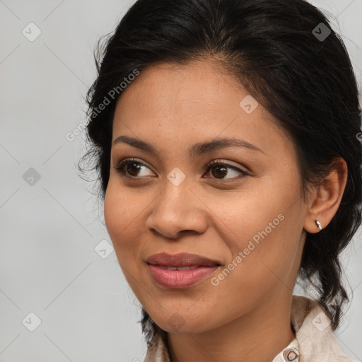 Joyful latino young-adult female with long  brown hair and brown eyes