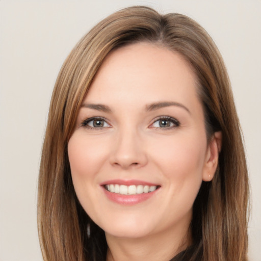 Joyful white young-adult female with long  brown hair and brown eyes