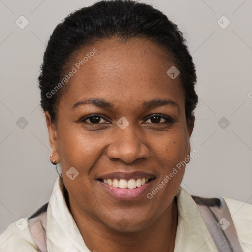 Joyful black adult female with short  brown hair and brown eyes