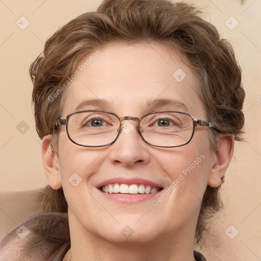 Joyful white adult female with medium  brown hair and blue eyes