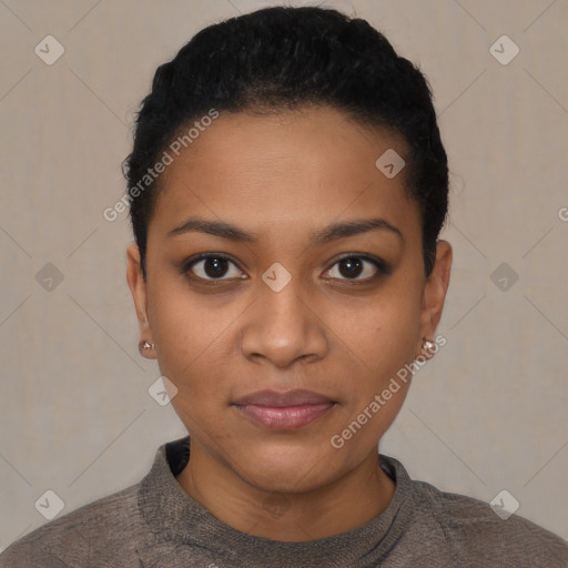 Joyful black young-adult female with short  black hair and brown eyes