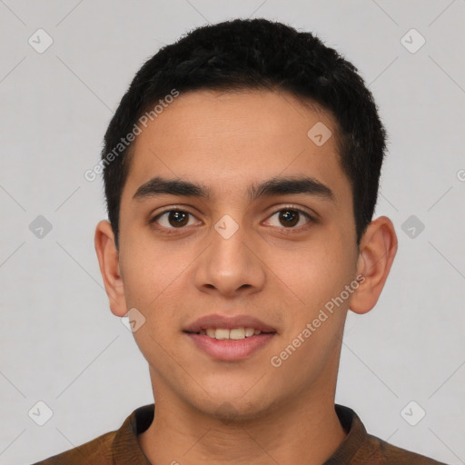 Joyful latino young-adult male with short  black hair and brown eyes