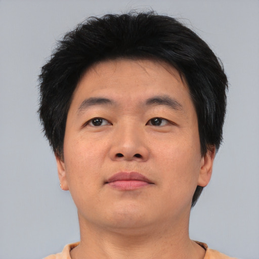 Neutral asian young-adult male with short  brown hair and brown eyes