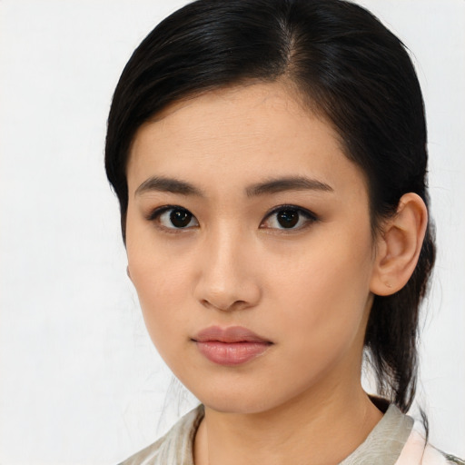 Neutral asian young-adult female with medium  black hair and brown eyes