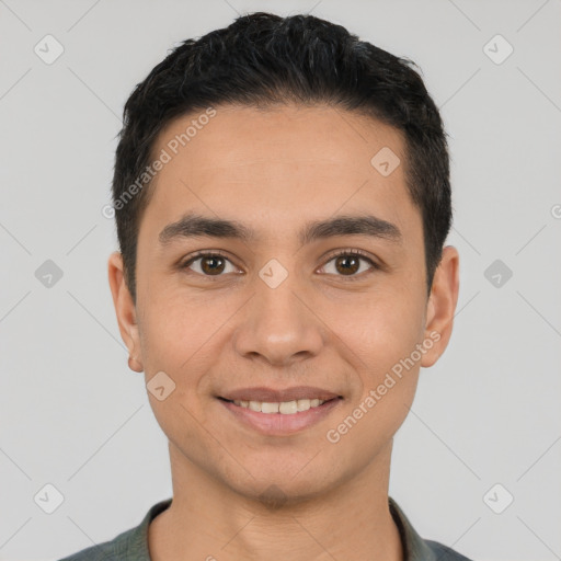 Joyful latino young-adult male with short  black hair and brown eyes