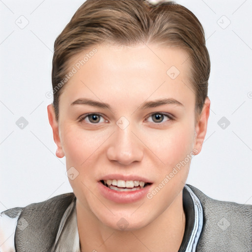 Joyful white young-adult female with short  brown hair and grey eyes