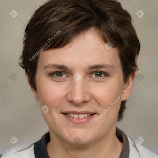 Joyful white adult female with medium  brown hair and grey eyes