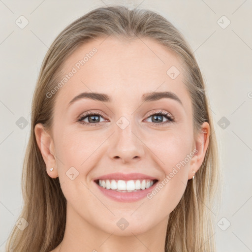 Joyful white young-adult female with long  brown hair and grey eyes