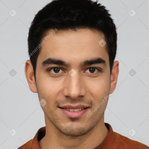 Joyful white young-adult male with short  black hair and brown eyes