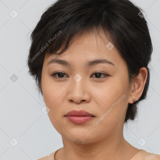 Joyful asian young-adult female with medium  brown hair and brown eyes