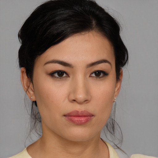 Neutral asian young-adult female with medium  brown hair and brown eyes