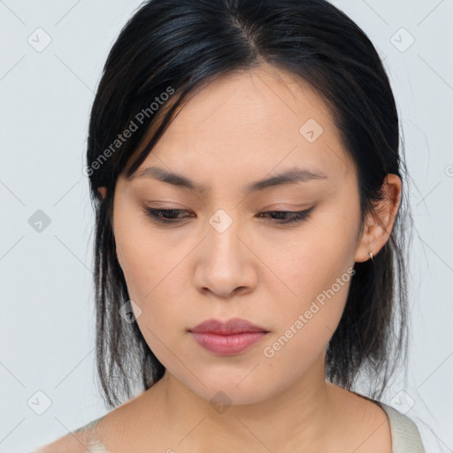 Joyful asian young-adult female with medium  black hair and brown eyes