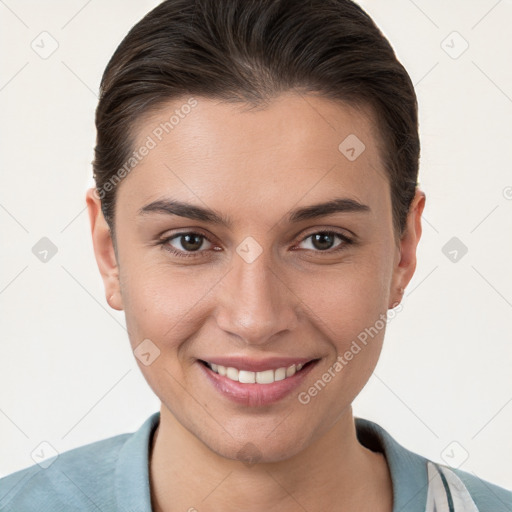 Joyful white young-adult female with short  brown hair and brown eyes