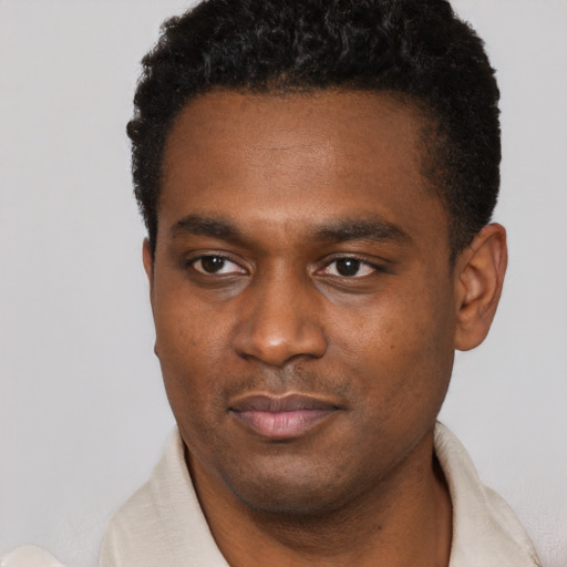 Neutral black young-adult male with short  black hair and brown eyes