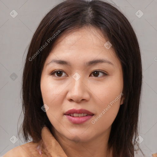 Joyful asian young-adult female with medium  brown hair and brown eyes