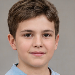 Joyful white child male with short  brown hair and brown eyes