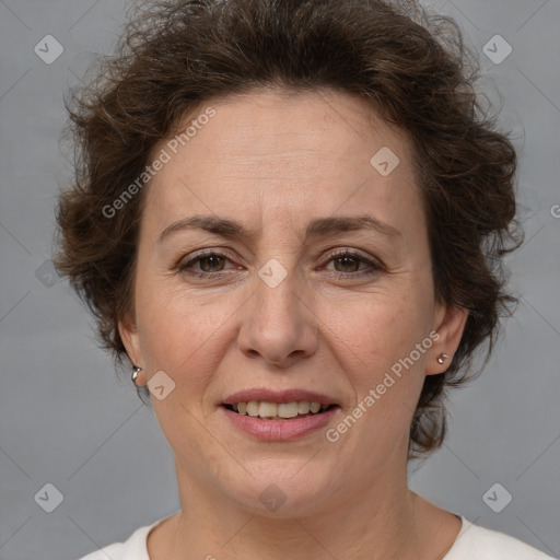 Joyful white adult female with short  brown hair and brown eyes