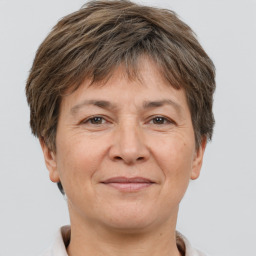 Joyful white adult female with short  brown hair and brown eyes