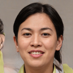 Joyful asian young-adult female with medium  brown hair and brown eyes