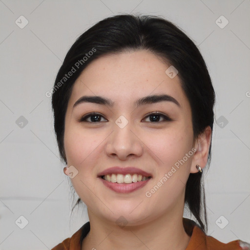 Joyful asian young-adult female with medium  black hair and brown eyes