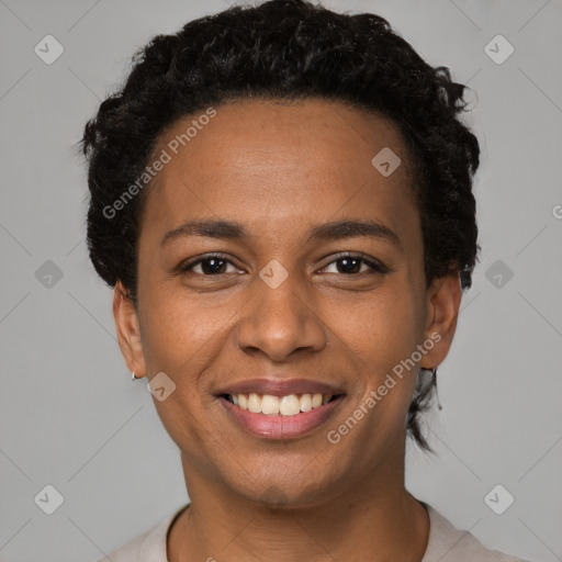 Joyful black young-adult female with short  brown hair and brown eyes