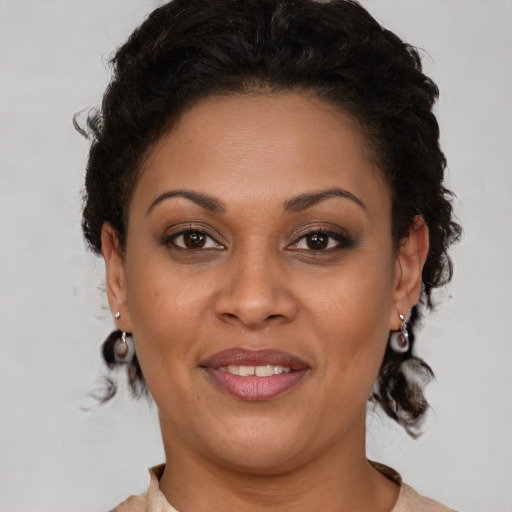 Joyful latino young-adult female with short  brown hair and brown eyes